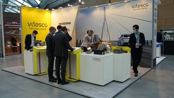 Welcoming visitors at our booth